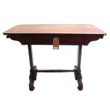 A Regency rosewood library table having a frieze drawer,