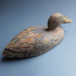 A 19th century wooden decoy duck