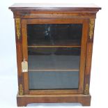 A 19th century walnut and satinwood inlaid pier cabinet with ormolu mounts and raised on carved