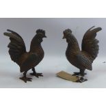 A pair of cast iron fighting cocks