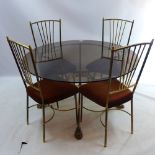 A set of four brass and brown velour dining chairs with pierced backs together with matching brass