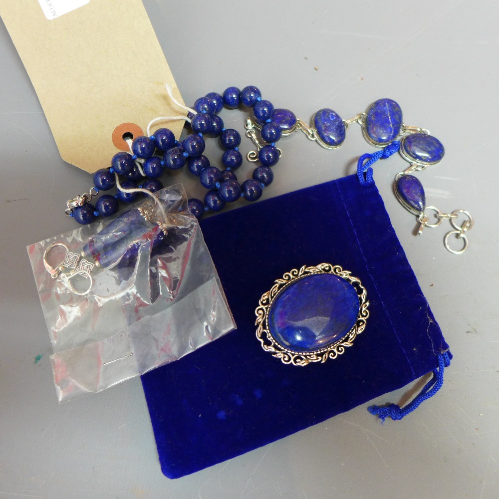 A suite of Lapis Lazuli jewellery including a beaded necklace, a bracelet,