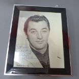 A signed studio photograph of Robert Mit