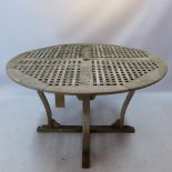 A pagoda circular garden table raised on