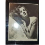 A signed photographic print of Jane Russ