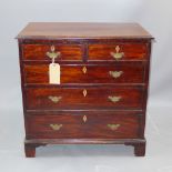 A Georgian mahogany chest of two short above three long graduating drawers raised on carved bracket