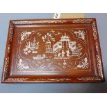 A Chinese hardwood tray with bone inlay decorated with figures in a courtyard scene,