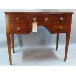 A Georgian mahogany bow fronted kneehole side table fitted with cupboards and drawers H 77 x W 90 x