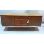 A mid 20th century elm sideboard having for short drawers flanked by two cupboard doors H 73 x W