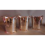 A set of three oval and etched silver plated wine coolers