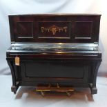 An Edwardian mahogany upright piano with makers name Berry of London,