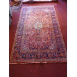 A central Persian Kashan carpet 340 x 200cm central floral medallion with repeating spandrels and