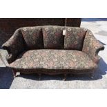 A mid - Victorian shell back sofa,