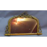 A gilt framed over mantle mirror decorated with swags,