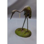 A painted wooden garden statue of a Heron (af) H 71cm