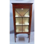 An Edwardian mahogany display cabinet having marquetry inlay H 142 x W 69 x D 30cm