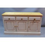 A contemporary light grey painted pine sideboard having three short drawers over three cupboard