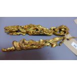 A pair of Chinese giltwood carvings depicting a dragon and a phoenix W 34cm