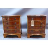 A pair of 20th century yew wood bedside chests with four drawers and raised on carved bracket feet,