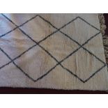 A white Moroccan Beni Ourain wool Berber rug with lozenge design 230 x 155cm