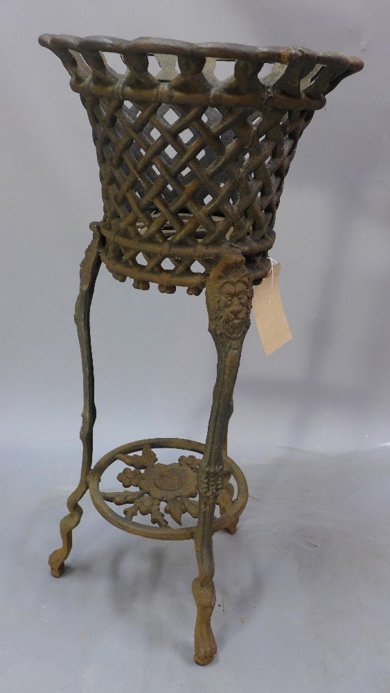 A cast iron planter raised on three supports joined by an undertier H 80 x W 33 x D 33cm