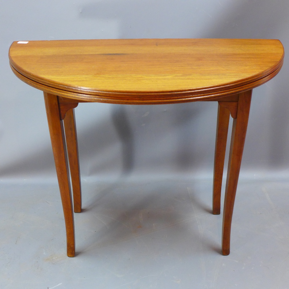 A 1930's walnut tea table with Strongbow Strongfold folding action H 78 x W 100 x D 52cm