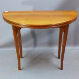 A 1930's walnut tea table with Strongbow Strongfold folding action H 78 x W 100 x D 52cm