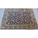 A fine central Persian Kashan rug 204 x 143cm all over petal motifs on a sapphire field within