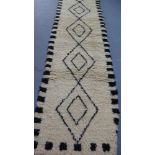 A Moroccan Berber Beni Ourain wool runner with lozenge design 370 x 80cm