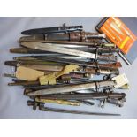 A collection of twenty WWI and WWII bayonets together with a folder containing full cataloguing of