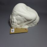 A Japanese white ceramic sculpture of a curled up woman, signed in Japanese 'Konno' dated 1980,