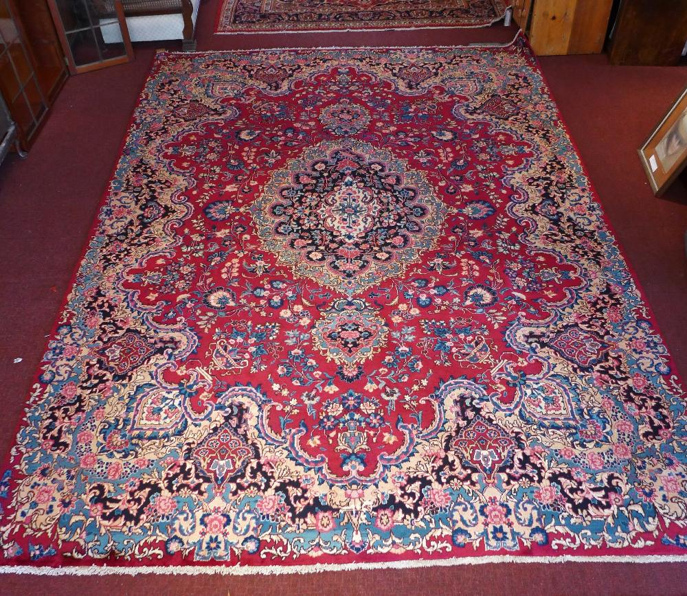 A signed Meshad carpet 350 x 255cm,