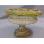 A large reconstituted stone garden planter of urn form H 43 x Diameter 63cm