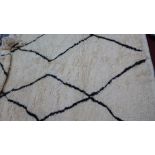 A Moroccan wool Beni Ourain wool Berber rug with elongated lozenge design 300 x 180cm