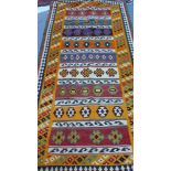 A fine south west Persian Qashgai kilim with repeating geometrical motifs all over within stylised