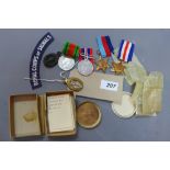 A collection of WWII medals together with Royal Corps of Signals badges