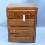 An early 20th century oak chest of four long drawers with oak bar handles H 79 x W 60 x D 44cm