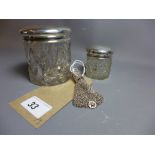 A silver mesh purse with elephant final together with two silver topped cosmetic jars