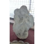 A reconstituted stone garden statue in the form of two lovers H 65 x W 36 x D 23cm