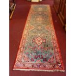 A fine central Persian Sarouk runner having repeating petal motifs all over within stylized floral