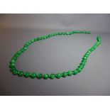 An opera length beaded jade necklace with silver bead dividers