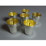 A set of six sterling silver French goblets with gilt interior.