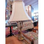 A Regency style brass table lamp decorated with swags together with one other