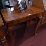 A burr walnut Queen Anne style side table, raised on cabriole legs and ball and claw feet.