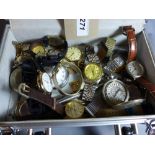 A collection of various wristwatches and pocket watches contained in a flight case