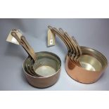 Two set of French copper saucepans with cast iron handles,