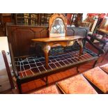 A late 18th / early 19th century oak settee with four panelled back,