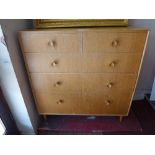 A 20th Century Merrydew oak chest of two short above three long drawers, raised on tapered legs.