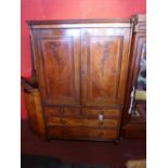 A Georgian mahogany and satinwood inlaid linen press with two cupboard doors above two short and