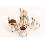 A late 19th Century aesthetic movement, three piece coffee set, standing on four paw feet with